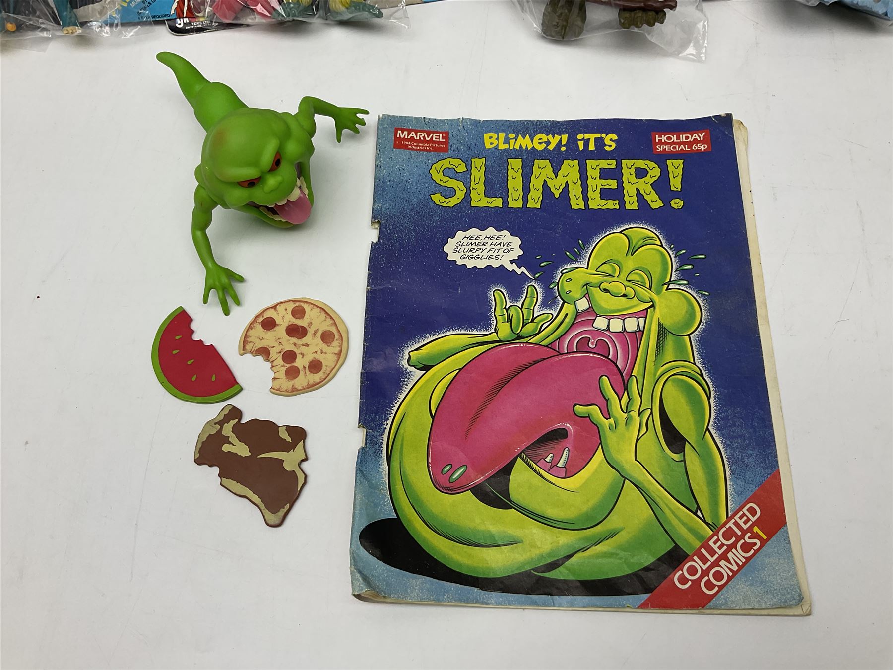 Five 1980s LJN Thundercats figures - Lion-O with sword, Snowman, S-S-Slythe, Tygra and Mumm-Ra; all re-bagged on original backing cards; partially stocked Panini sticker album; story cassette tape and three catalogues; together with Ghostbusters Slimer with food and Comic