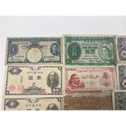 Banknotes including King George VI board of commissioners of currency Malaya one dollar 1st July 1941 'P/59 030908', Queen Elizabeth II Government of Hongkong one dollar 1st July 1952 'F/6 202153' etc