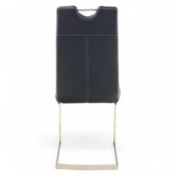 Set of seven contemporary style dining chairs, each with a high padded back and seat upholstered in faux leather on brushed steel sled bases  