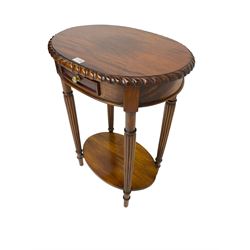 Oval mahogany side or lamp table, gadroon moulded top over single drawer and undertier, turned and reed carved supports 