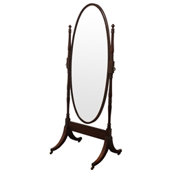  Edwardian inlaid mahogany Cheval mirror, with oval plate on ring turned supports, four sabre legs with square brass sockets and castors, H174cm, W66cm   