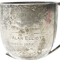 Silver trophy, small silver toast rack and a silver napkin ring