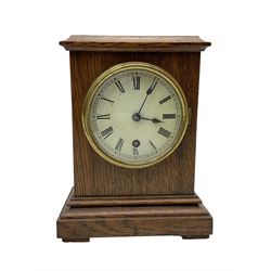 German - late 19th century oak cased 8-day timepiece mantle clock , with a flat top, moulded  base raised on block feet, painted dial with Roman numerals and spade hands within a glazed brass bezel, spring driven movement with pendulum and key. 