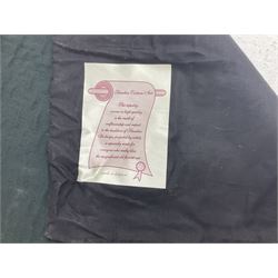 Three tapestries comprising 20th century wool tapestry panel of a medieval nobleman upon a horse with a castle in the distance, together with a smaller tapestry depicting The English Coat of Arms, both hung on rails, and further depicting village scene, largest approx 132cm x 95cm