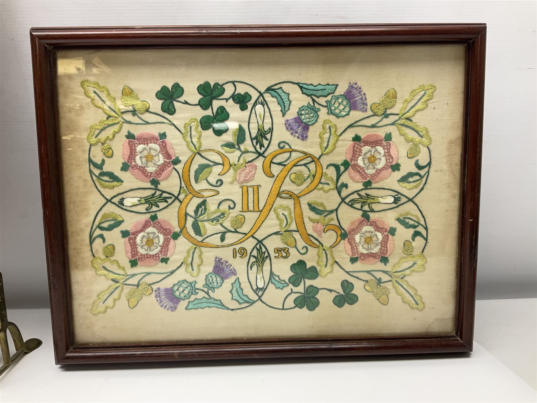 Two 1950s tapestries, the framed example celebrating the 1953 coronation, the second converted into a fire screen depicting a floral display, firescreen H70cm (2)