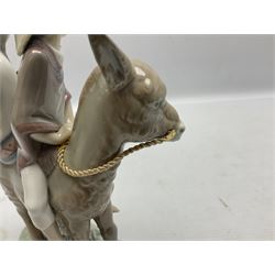 Lladro figure, Ride in the Country, modelled as modelled as a young boy and girl riding upon a donkey, sculpted by Jose Puche, with original box, no 5354, year issued 1986, year retired 1994, H20cm 