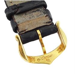 Cartier Tank ladies 18ct gold quartz wristwatch, back case No. M 21001496, white dial with Roman numeral hour markers, on black leather strap with 18ct gold buckle, both by Cartier, hallmarked