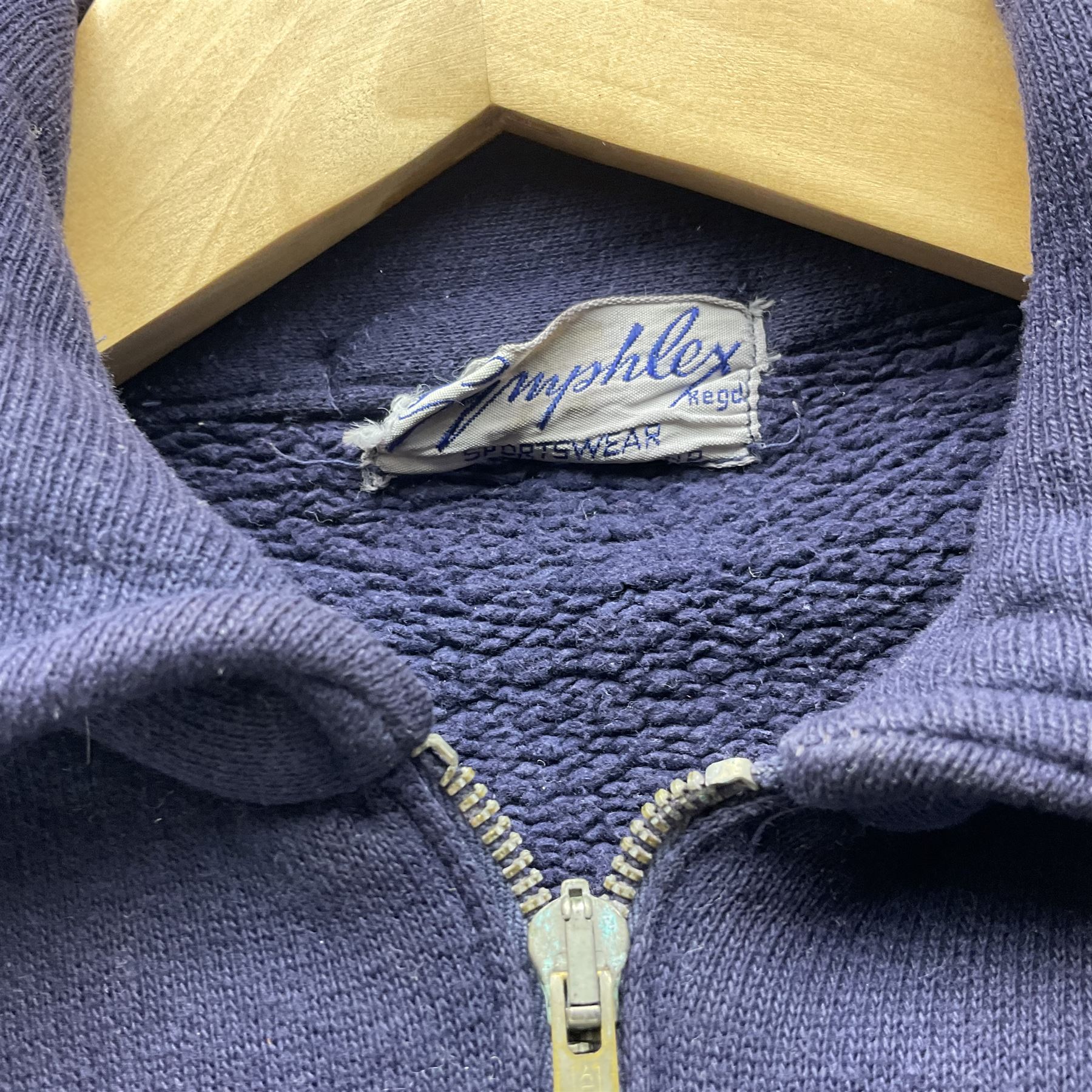 On the direct instructions of Anita Porter nee Lonsbrough Great British Olympic and Commonwealth Games gold medal winning swimmer - collection of early and international memorabilia comprising original Huddersfield Bath Club track suit top bearing eight stitched on cloth badges including British Empire & Commonwealth Games 1958 England Team, YSASA, North Eastern Counties ASA, ESSA Division 3,  English Schools Swimming Association winner etc
The swimming costume Anita wore at the 1958 Commonwealth Games in Cardiff, her first major championships, where she won two gold medals. The grey elastic on the sides, in those days, she would use to make it tighter and more streamlined.
Blue track suit from the 1960 Olympics which she wore on the podium receiving the gold medal.
1960 pool side towelling robe used at the Rome Olympics (interesting to note her name is spelt wrong on the embroidered label).
1962 Commonwealth Games pool side towelling robe used in Perth Australia when winning three Gold medals. 
It was also this year she became BBC Sports Personality of the year, the first female to do so.
Her 'lucky' pool side towel which she took with her to every event she competed in and which can be seen round her neck in many official celebratory photographs. Copies of some of these photographs are included for identification.
In addition there are two souvenir programmes of an evening event to honour Anita at The Theatre Royal Huddersfield and she has kindly signed the front cover on one of these.