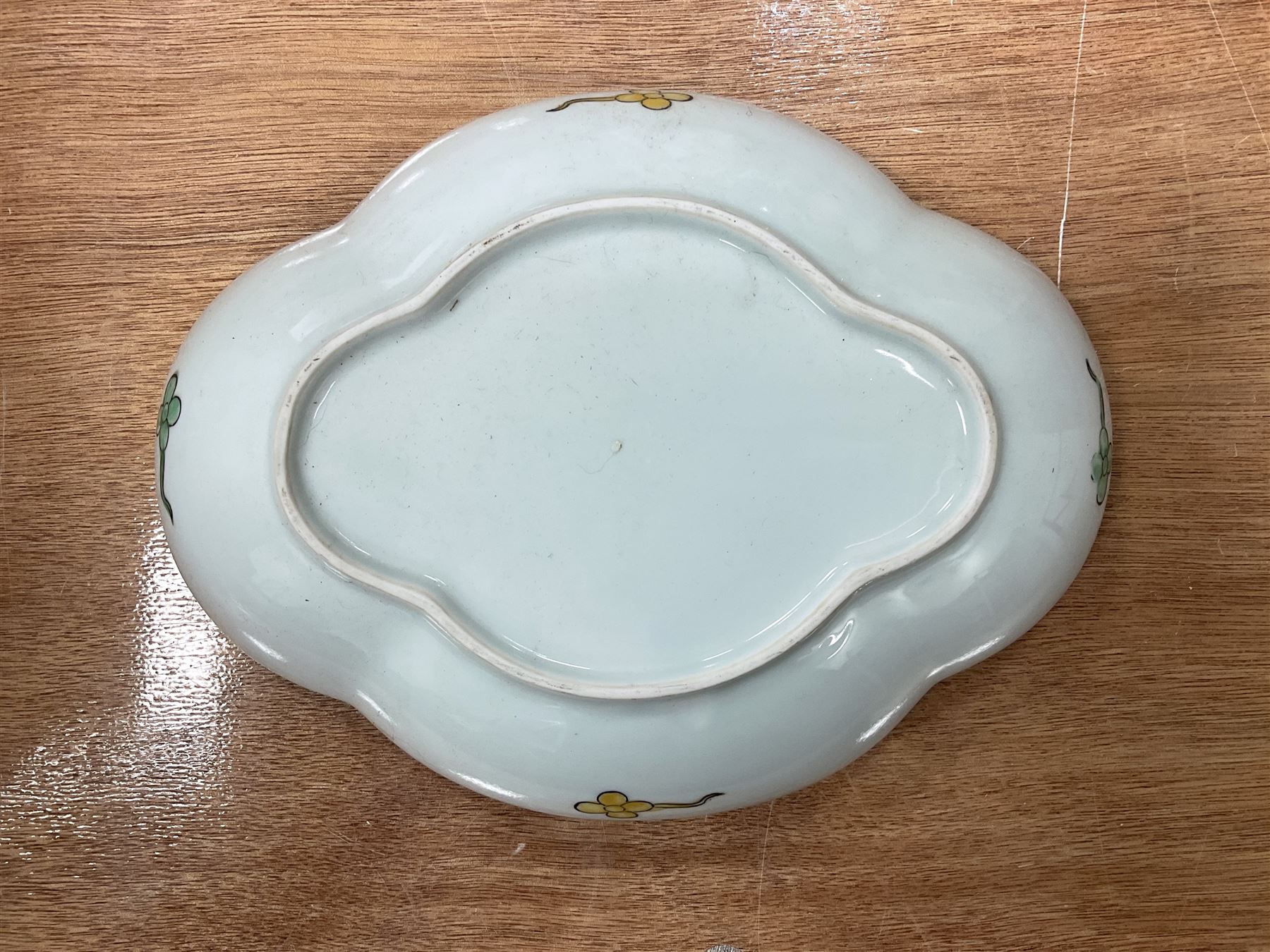 Oriental bowl of shallow form decorated with painted koi fish and sea plants, L25cm