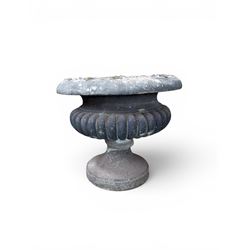 Carved sandstone garden urn, gadrooned campana form