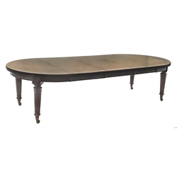 Spillman & Co. London - large Victorian mahogany extending dining table with three additional leaves, on turned and reeded supports with ceramic castors, ivorine label to underneath 'Spillman & Co. St. Martins Lane, London', diameter - 137cm (closed), L302cm (with all leaves)