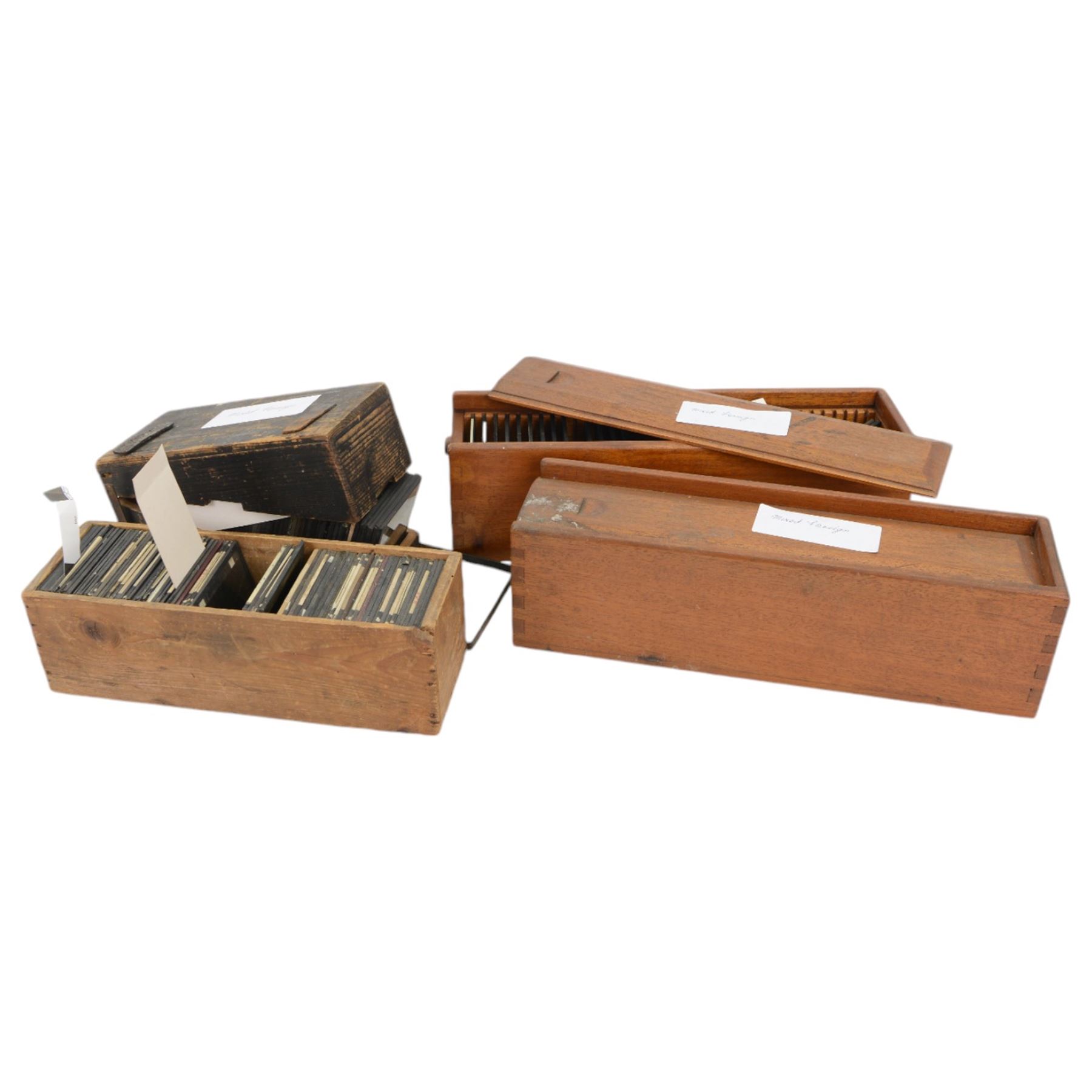 Collection of magic lantern slides, including views of Scarborough, shipping and harbour scenes, animals, travel and tourist views, etc, contained within four wooden cases