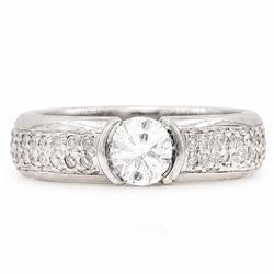 18ct white gold diamond ring, half bezel set with a single round brilliant cut diamond of ...