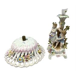 Early 20th century Sitzendorf porcelain centrepiece, the pierced floral encrusted bowl supported on a tree formed pedestal with two children playing, H34cm