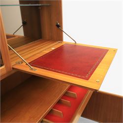Mid-20th century teak wall display unit, featuring two glazed cupboards and fall front compartment with open shelves, above three drawers and cupboards to the base