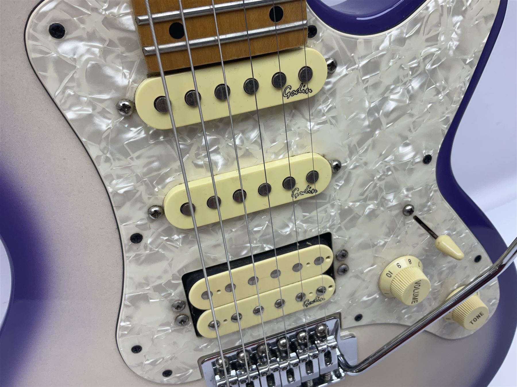 Canadian Godin SD electric guitar in two-tone purple/white with bird's eye maple neck and tremolo, serial no.98455463, L100cm overall; in soft carrying case.
