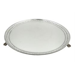 1930's silver salver, of circular form with husk border and beaded rim, upon three ball and claw feet, hallmarked James Dixon & Sons Ltd,  Sheffield 1936, D25.5cm, approximate weight 17.23 ozt (536 grams)