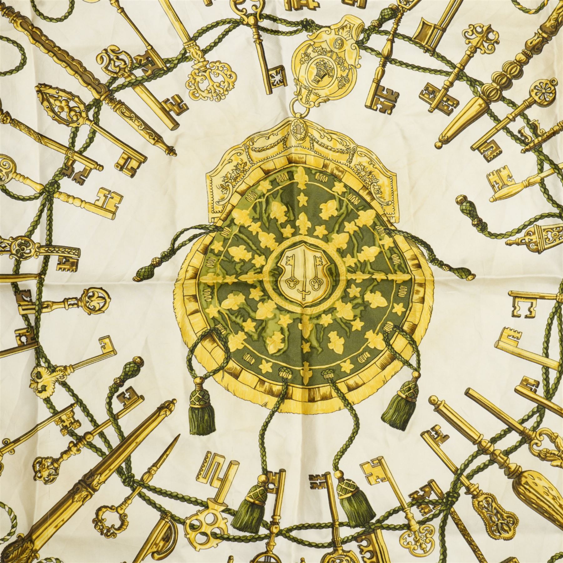 Hermes 'Les Clefs' silk scarf in green and gold colourway, designed by Cathy Latham, 86cm x 90cm 