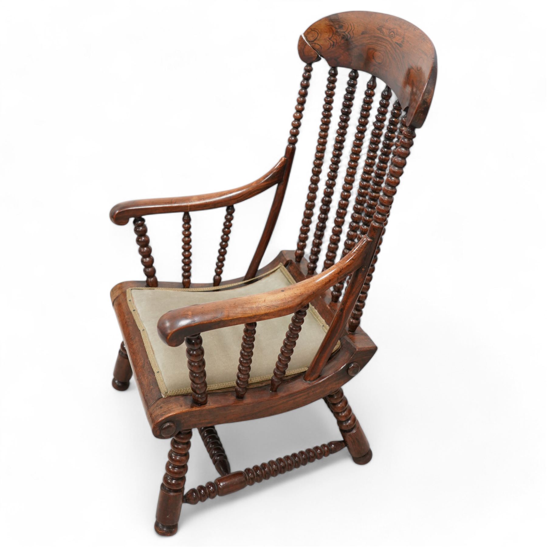 19th century simulated rosewood and stained beech framed armchair, shaped cresting rail over bobbin turned rails, on bobbin tuned supports united by stretchers 