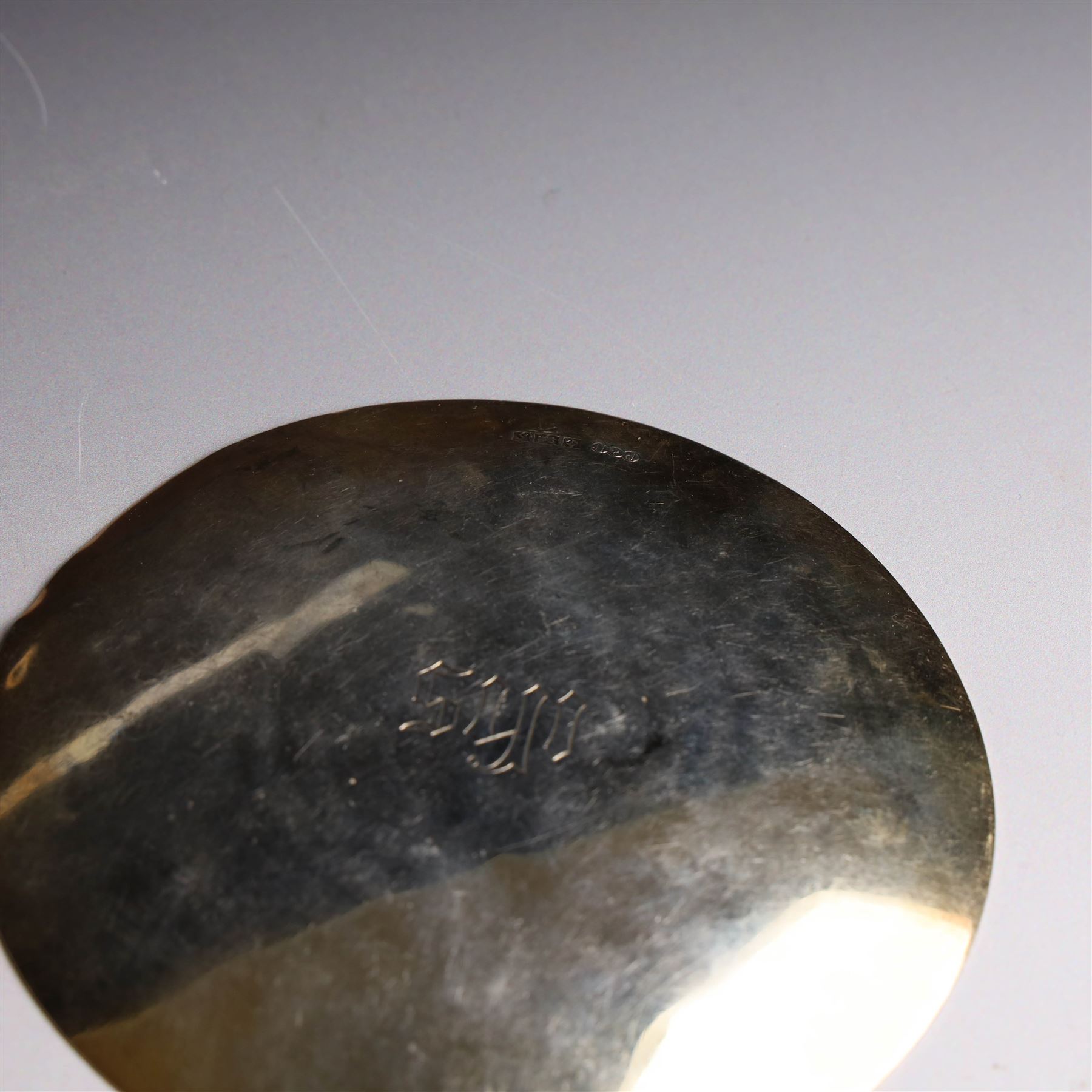 Two silver-gilt patens, comprising French silver example, of typical flatted circular form, engraved IHS to underside, with Minerva's head mark to one side and a 1960s example of similar form engraved IHS to underside, hallmarked Pepper & Hope Ltd, Birmingham 1967, largest D12.5cm