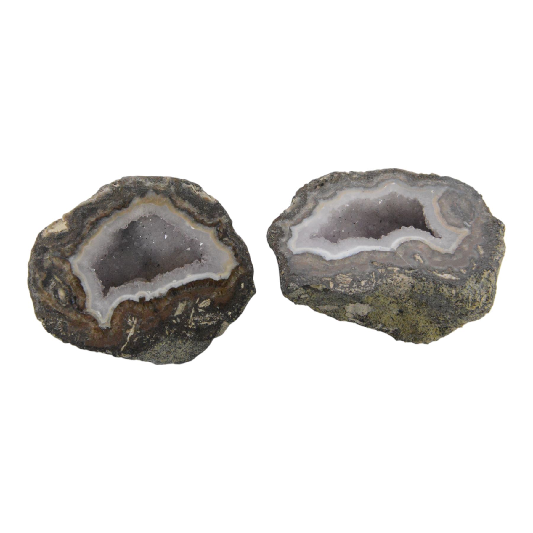 Collection of polished egg shaped mineral specimens, together with amethyst geodes and other minerals  