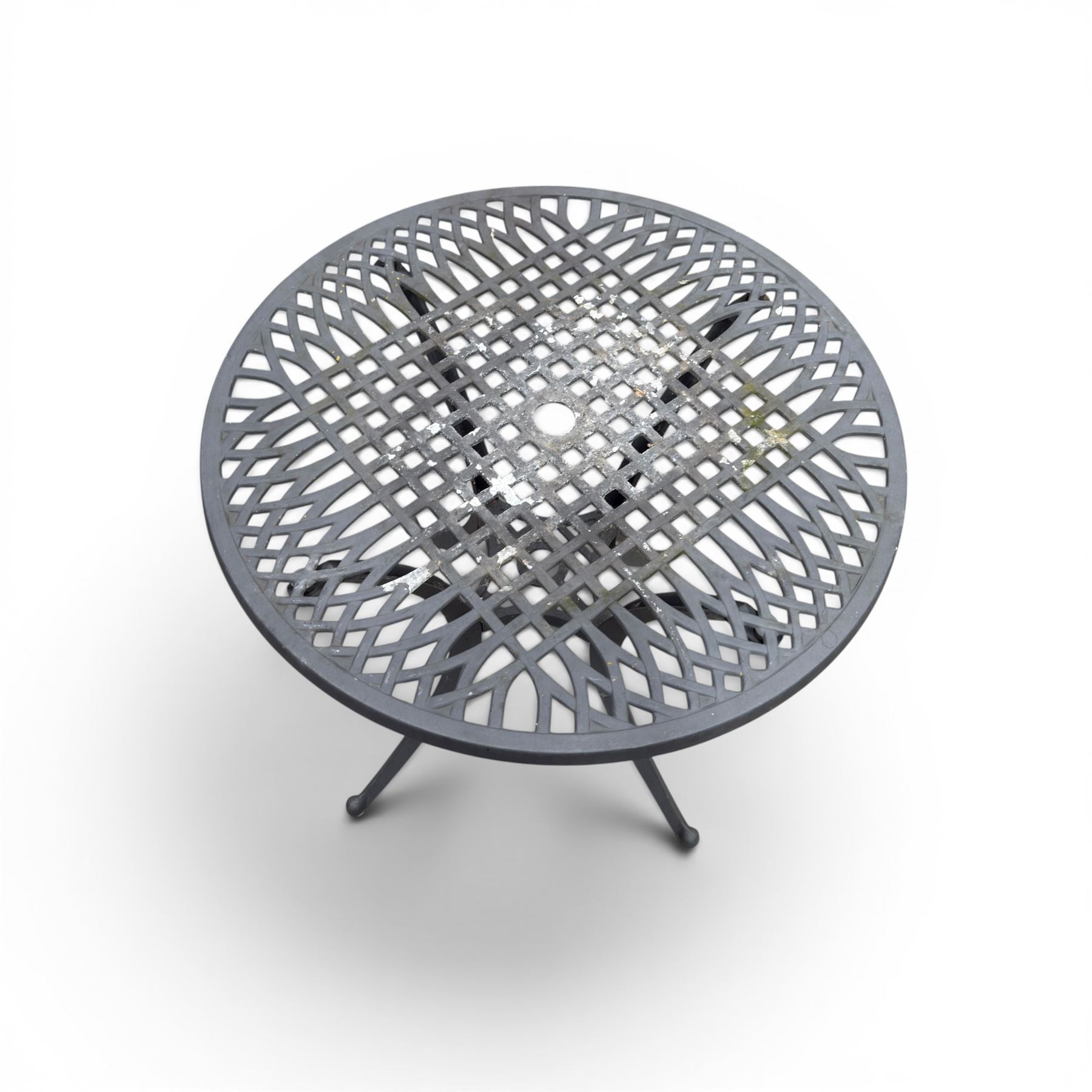 Circular aluminium garden table and pair of armchairs chairs with a pierced and scrolling backs 
