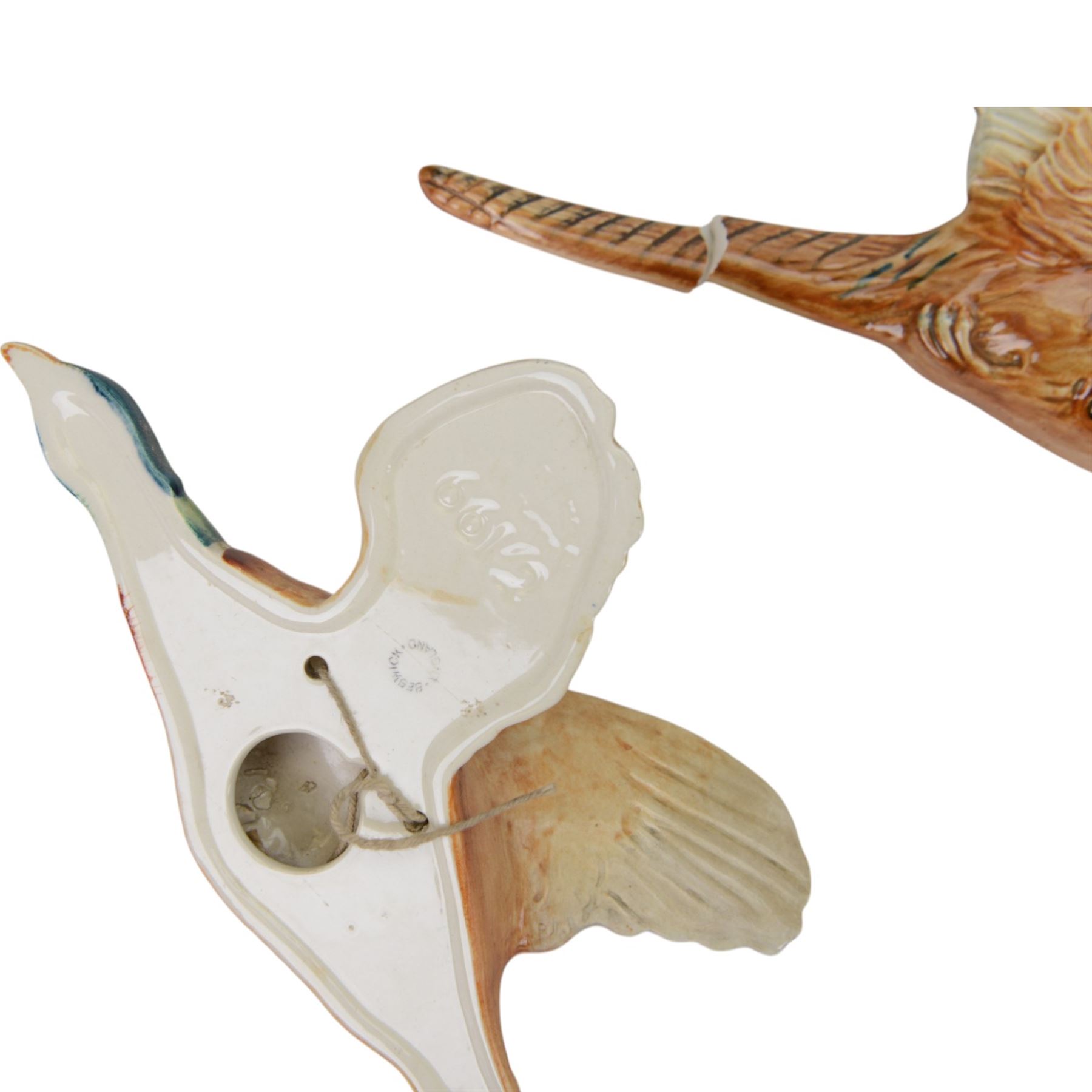 Set of three graduating Beswick pheasant wall plaques, all with printed marks beneath and impressed 661, largest H14cm