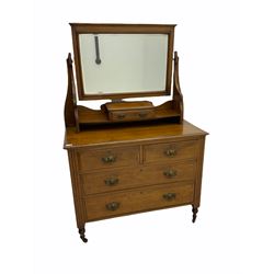 Edwardian oak dressing chest, bevelled swing mirror, two short and two long drawers