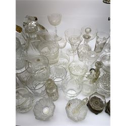 A number of Victorian tumblers and Edwardian drinking glasses, together with a large quantity of other later glassware, to include a glass table lamp base, drinking glasses of various forms, a number with cut decoration, other assorted cut glass including jug, vases, jars and covers, etc. 