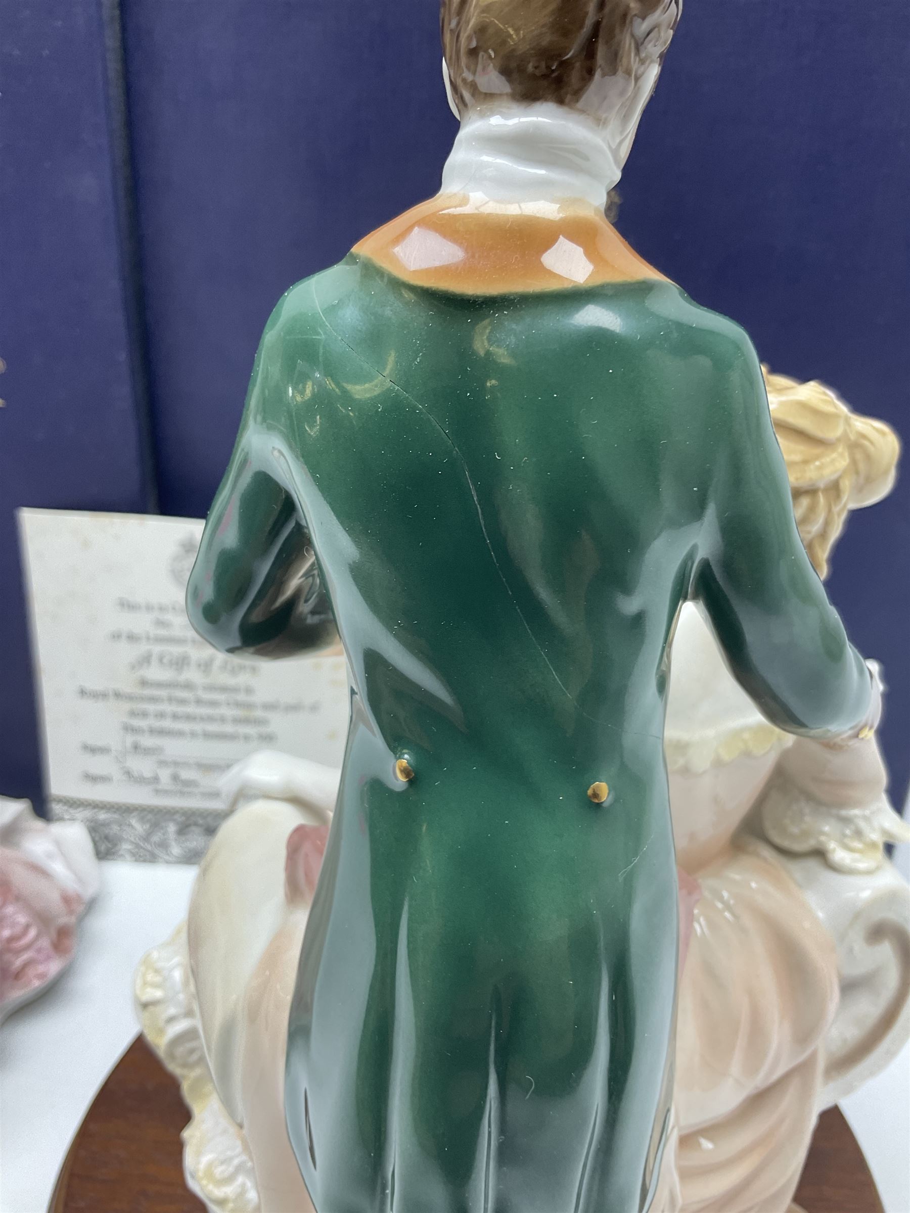 Two Royal Worcester figures, comprising A Gift of Love from the Age of Romance Series, limited edition 325/500, with certificate and original box and Royal Premier from the Glittering Occasions series, with original box 