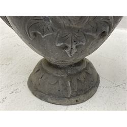 Pair lead garden urn planters, the bodies decorated with classical masks in foliage surrounds and with scrolled handles, circular stepped and leaf moulded footed bases