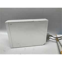 Nintendo Wii console, four controllers with cases and four nunchucks, Wii sensor bar, balance board and dance mat. Guitar hero wireless guitar for Wii and Redoctane wired guitar. Nintendo DS lite handheld gaming console, console and game cases and Guitar Hero Redoctane Guitar Grip. Selection of Nintendo Wii and Nintendo DS lite games to include Super Mario Galaxy, Guitar Hero, Wii Fit, Legend of Zelda games etc. Archos AV400 Series pocket video recorder with accessories, cradle and remote, in three boxes