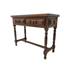 Spanish oak side table, fitted with two drawers with moulded facias, raised on turned supports united by stretcher