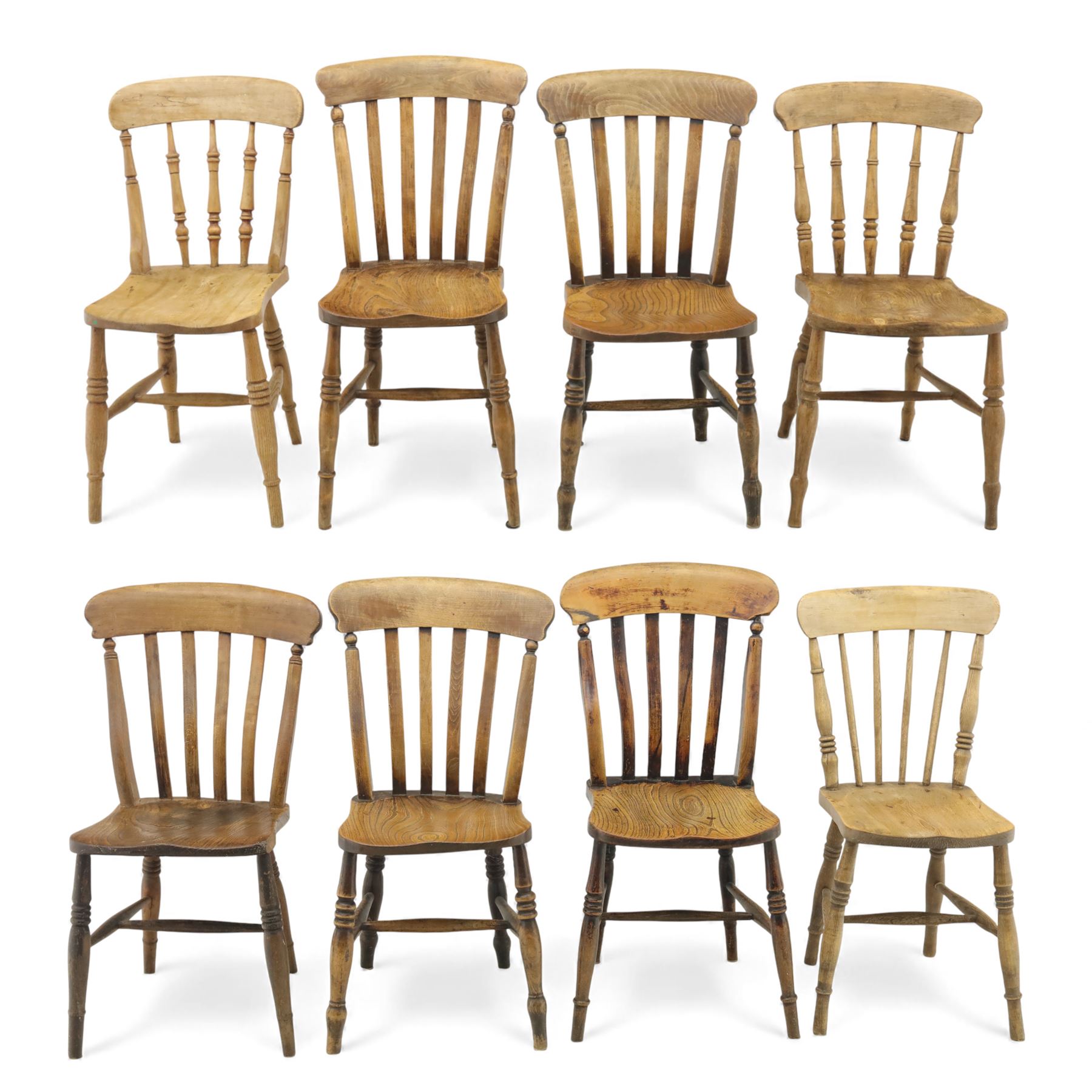 Eight Victorian farmhouse chairs in elm and beech, spindle-back frames with moulded seats, on turned and plain supports