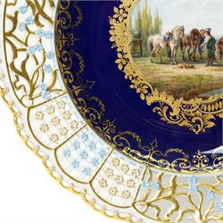 19th century Meissen cabinet plate, the reticulated border modelled with trellis panels and forget-me-nots,  the cobalt blue well with gilt bordered central reserve painted with a scene of a hunting party resting after Philips Wouwerman (Dutch 1619-1668), underglaze blue crossed swords and indistinct impressed numbers verso, D26cm