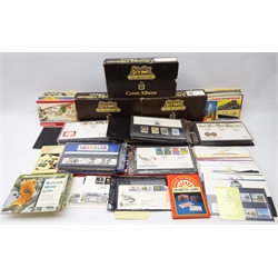  Collection of Great British presentation packs and first day covers over thirty presentation packs, three Stanley Gibbons cover albums with mostly 1980s FDCs and Brooke Bond picture cards in booklets, in one box  