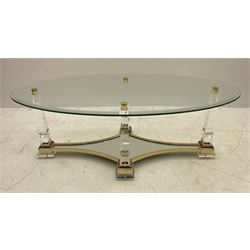 Classical style glass and brass oval coffee table, quatrefoil polished brass mirror base topped by glass obelisk legs