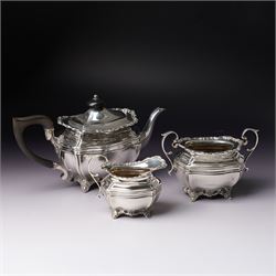 Edwardian silver three piece bachelors tea set of panel sided rectangular form with shell ...