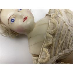 Victorian wax shoulder head doll with pale complexion, applied hair, inset glass eyes and fabric covered jointed body with kid leather lower arms; white linen dress and undergarments H50cm
