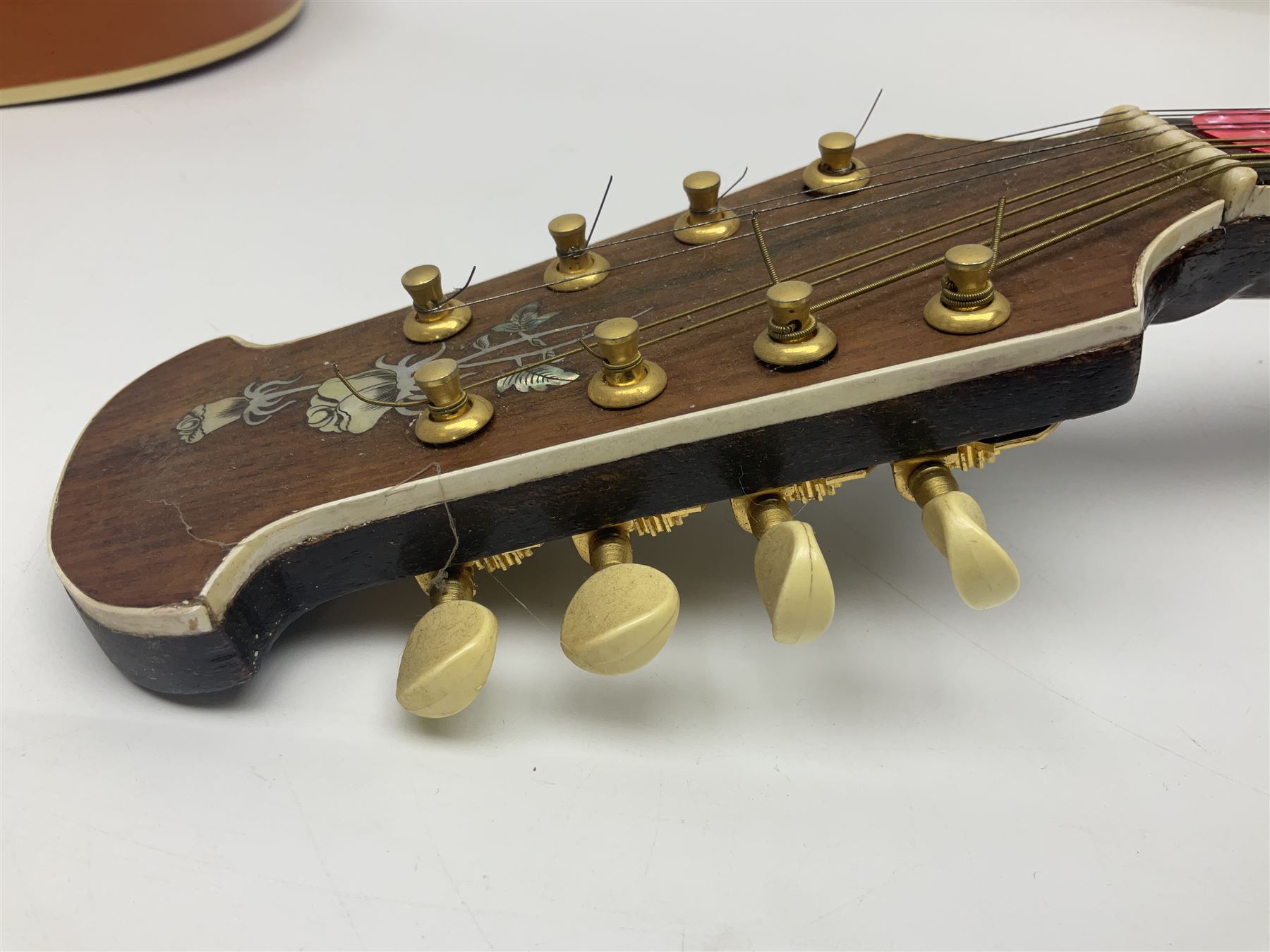 Eastern eight-string mandolin with sunburst finish and mother-of-pearl inlay L68.5cm; and another Harmony mandolin with cracked headstock (2)