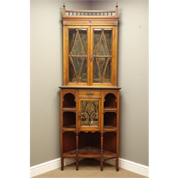  Late Victorian walnut corner display cabinet, the upper mirrored section enclosed by two doors with beveled glass panes, drawer, cupboard and shelving below, W77cm, H209cm  