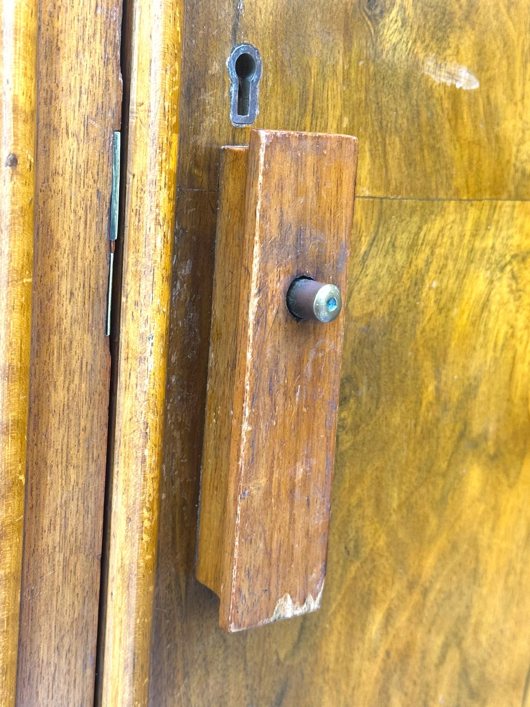 Ashton Leach & Cumberbirch Ltd., Rochdale - early 20th century walnut and mahogany gentleman's wardrobe, arched moulded top with book-matched figured walnut veneers, double doors enclosing fitted interior with hanging rail, tie rack and drawers, raised on cabriole supports