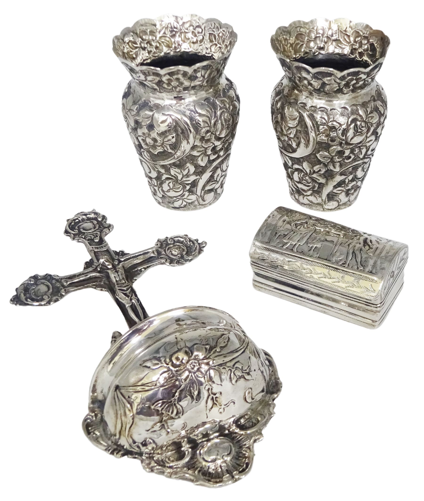 Early 20th century German silver holy water stoop, modelled as Christ upon the cross above a curved cistern with embossed floral decoration, stamped verso 800, also bearing crown and crescent mark and makers mark for Simon Rosenau, H17.5cm, together with a small pair of Continental silver vases, each embossed throughout with flower heads, each stamped beneath 800, and a Dutch box of rectangular form, the underside embossed with hunting scene, the domed cover with two figures, marked with Lion Passant purity mark, Minerva head duty mark, and date letter, probably 1886, approximate total weight (333 grams)