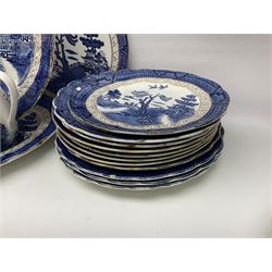 Booths Real Old Willow pattern part tea and dinner service, to include two meat platters, cake stand, teapot, two jugs, sugar bowl, sauce boat, teacups and saucers and a collection of plates and bowls