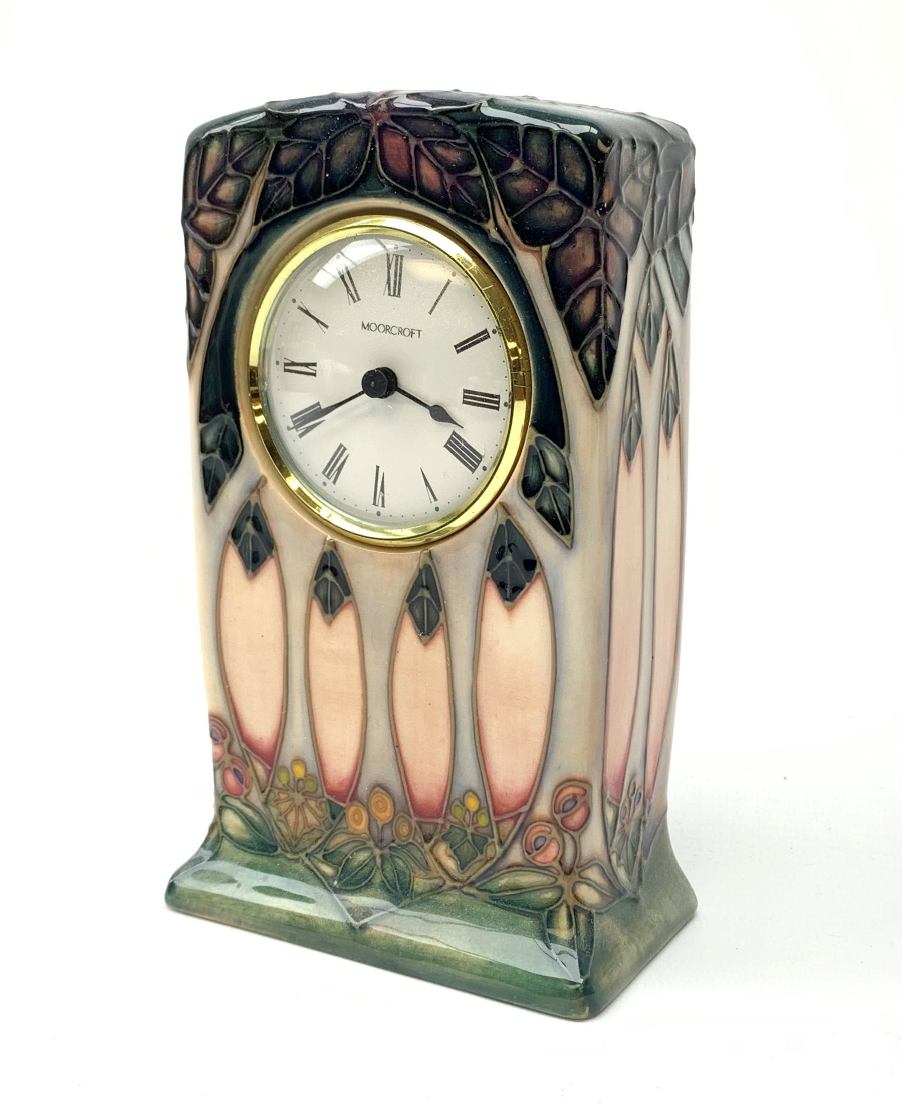 A Moorcroft mantle clock, decorated in the Cluny pattern designed by