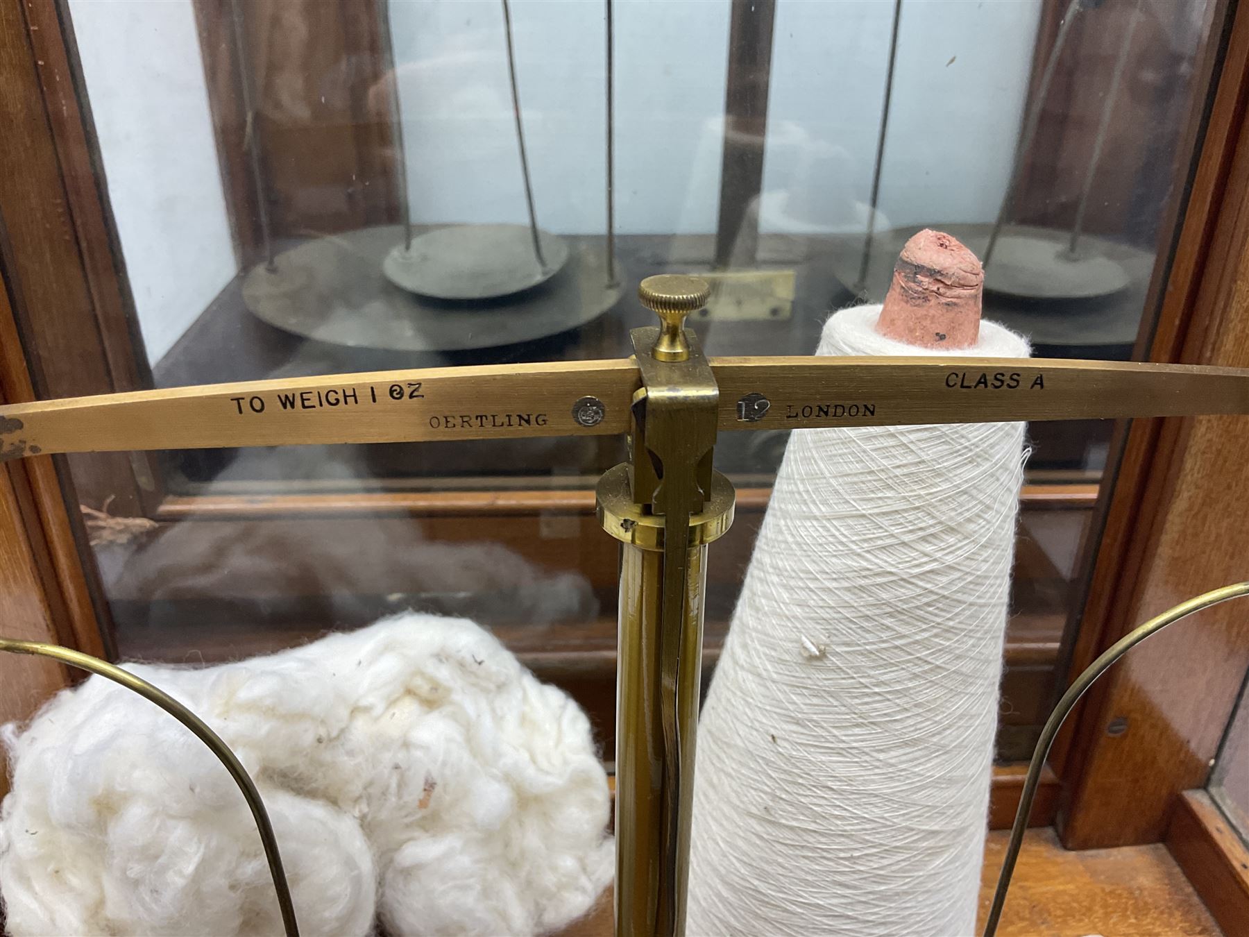 Collection of textile equipment, comprising, Goodbrand & Co. mahogany and brass yarn tester, Negretti & Zambra barograph and two sets of precision scales