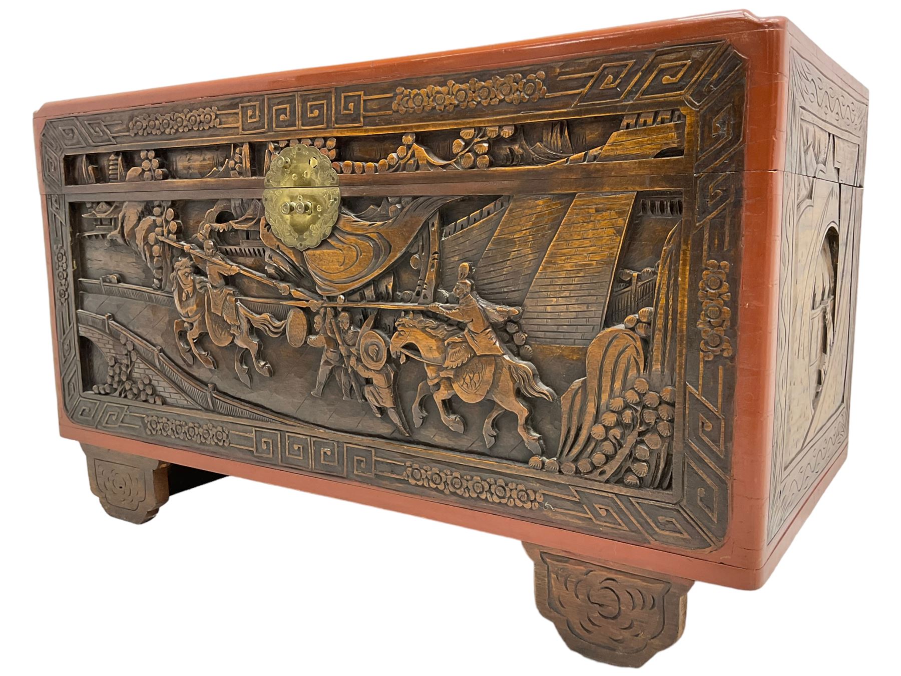 Mid-20th century Singapore camphor wood blanket chest, heavily carved depicting battle scenes and cityscapes 
