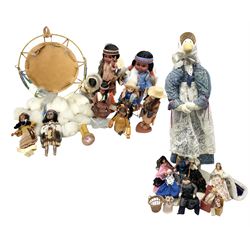 Collection of Native American sleep eye dolls to include approximately five Carlson examples, in traditional leather, beaded and fur dress, together with native style wall hanging, Large stuffed figure of Mother Goose, Ann Fuller designs Jack in the box and another with mother and baby, two Sheena Macleod Highland character dolls, Mole End tape measure, Peggy Nisbet Queen Elizabeth and others etc, tallest H85cm
