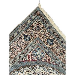 Large Persian Kashan ivory ground carpet, the field decorated with curled leafy branches with stylised plant motifs, shaped foliate design central medallion, the guarded border with repeating floral design 