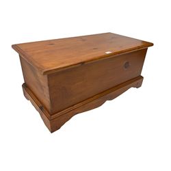 Solid pine blanket  box, hinged top, on shaped and moulded plinth base